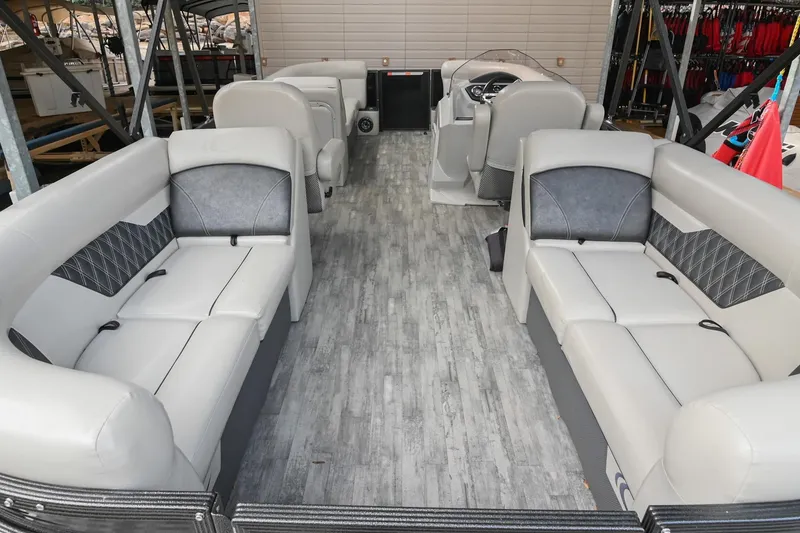 Slide: The Image of 2021 Crest Classic DLX 220 L pontoon boat interior with spacious seating and modern design. - 8