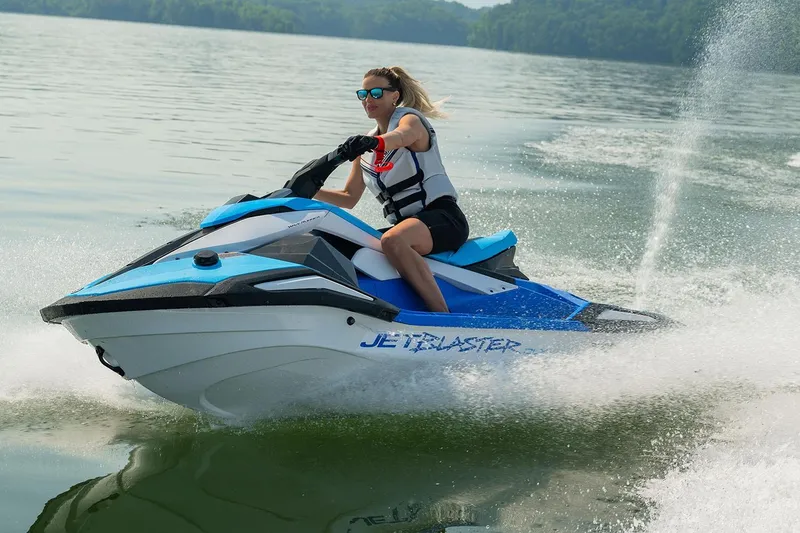 Slide: The Image of Manufacturer Provided Image: Person riding 2026 Yamaha WaveRunner JetBlaster DLX 2-Up on a lake, creating a splash. - 1