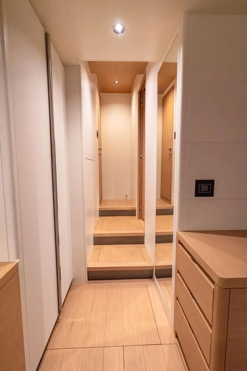 Slide: The Image of Interior hallway of 2023 Pardo Yachts Endurance 60, featuring modern wood finishes. - 32