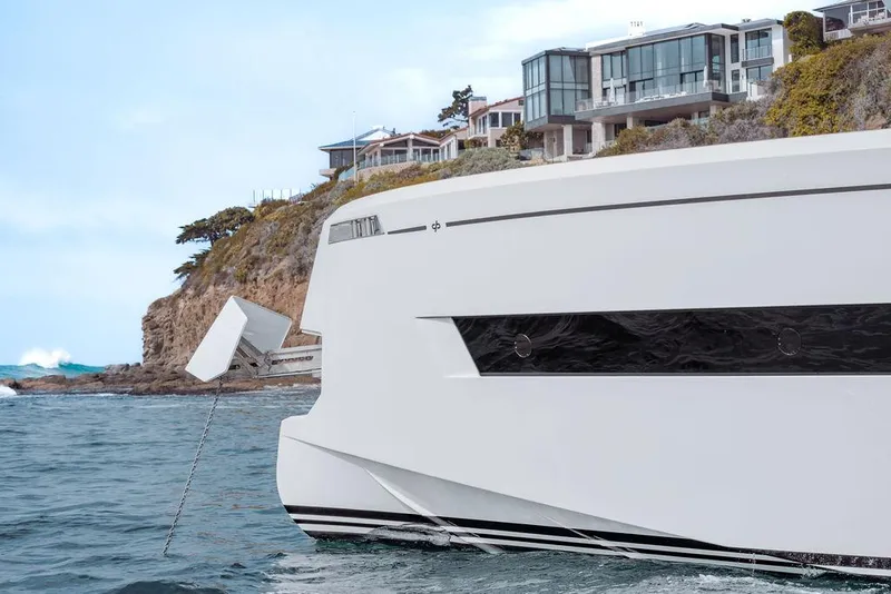 Slide: The Image of Pardo Yachts Endurance 60, 2023 model, anchored near coastal luxury homes. - 6