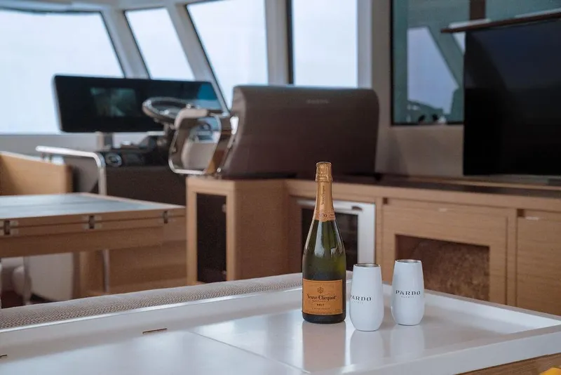 Slide: The Image of Luxurious interior of 2023 Pardo Yachts Endurance 60 with champagne and glasses. - 9