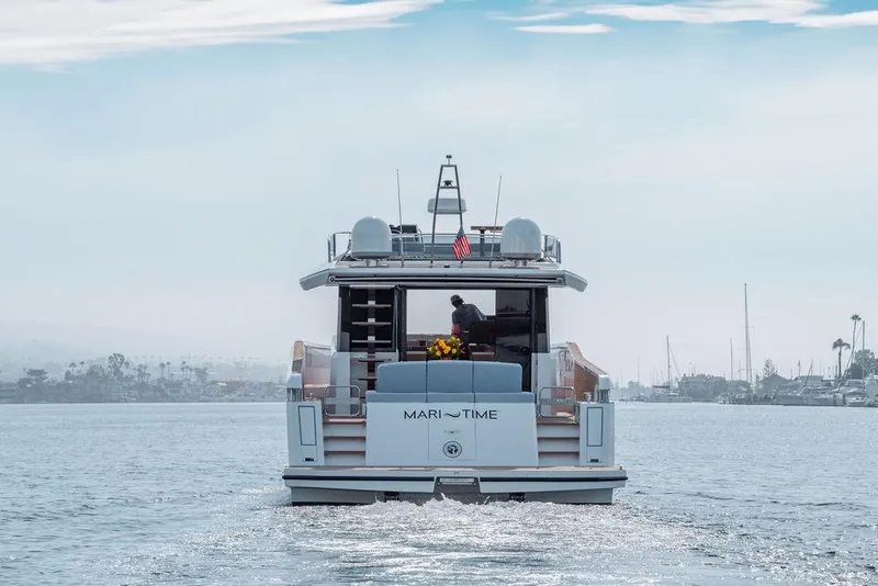 Slide: The Image of 2023 Pardo Yachts Endurance 60 cruising on a calm waterway. - 40