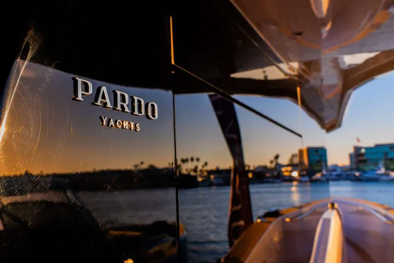 Slide: The Image of Pardo Yachts Endurance 60, 2023 model, reflecting sunset over marina. - 5