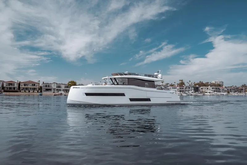 Slide: The Image of Pardo Yachts Endurance 60, 2023 model, cruising on calm waters under a blue sky. - 7