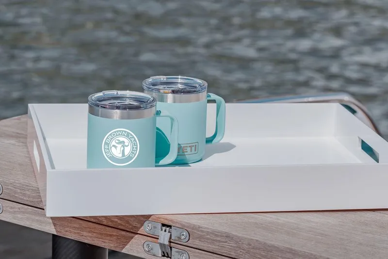 Slide: The Image of Two teal mugs on a white tray aboard a 2023 Pardo Yachts Endurance 60. - 8