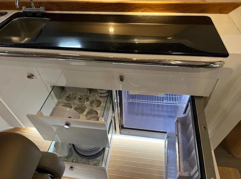 Slide: The Image of Interior of Nimbus Weekender 9 with fridge and drawers. - 11