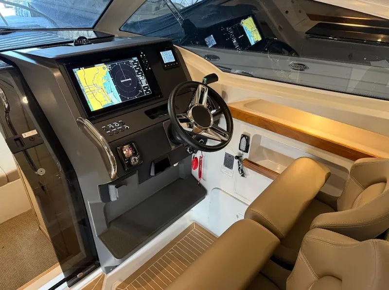 Slide: The Image of Interior of 2024 Nimbus Weekender 9 with modern helm console. - 12