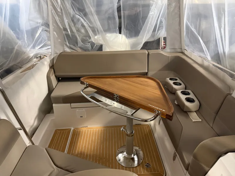 Slide: The Image of Interior of 2024 Nimbus Weekender 9 with wooden table and seating. - 3