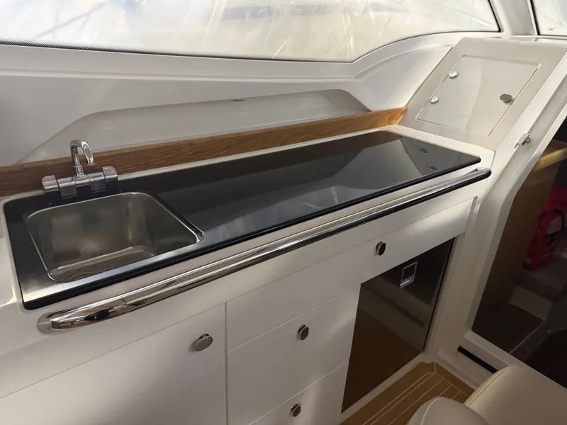 Slide: The Image of Interior of 2024 Nimbus Weekender 9 yacht with modern kitchenette. - 7