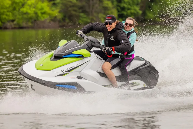 Slide: The Image of Manufacturer Provided Image: Two people enjoying a ride on a 2026 Yamaha WaveRunner VX Deluxe jet ski. - 1