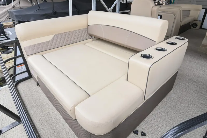 Slide: The Image of Luxurious seating on 2022 Crest Classic DLX 220 pontoon boat with cup holders. - 10