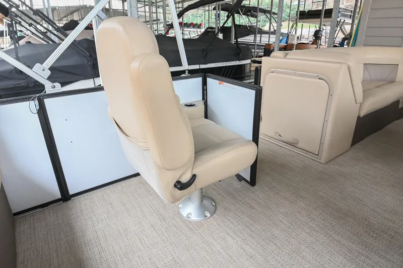 Slide: The Image of Beige seating on 2022 Crest Classic DLX 220 pontoon boat interior. - 17