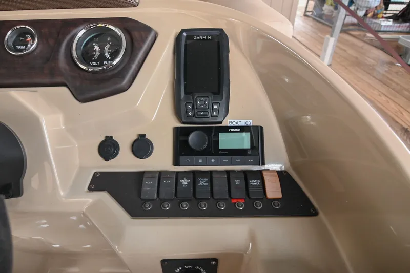 Slide: The Image of Control panel of 2022 Crest Classic DLX 220 boat with gauges and switches. - 23