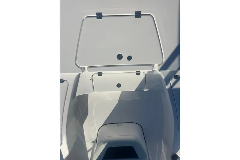 Slide: The Image of 2026 Tidewater 2210 Carolina Bay boat storage compartments, open and ready for use. - 12