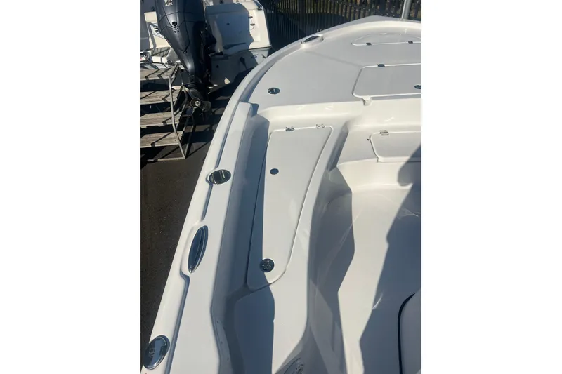Slide: The Image of 2026 Tidewater 2210 Carolina Bay boat deck with sleek design and modern features. - 13