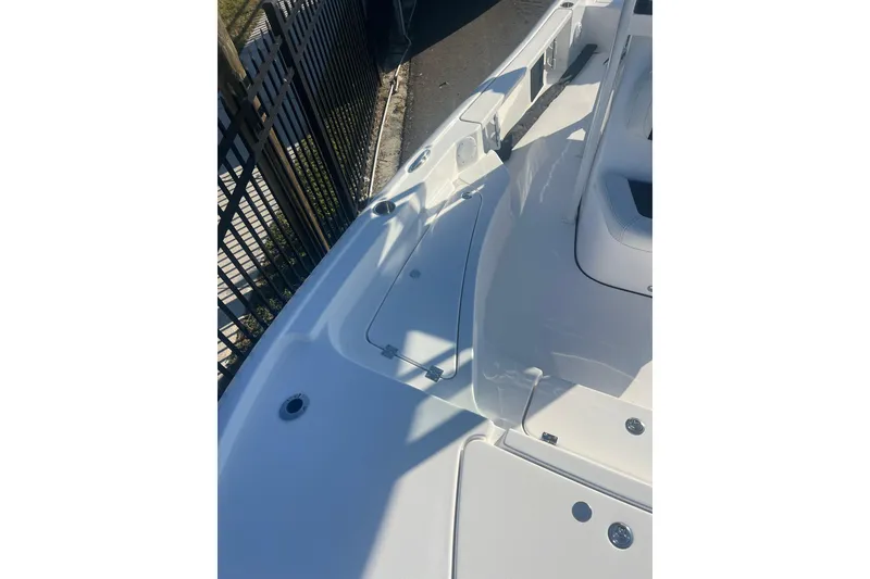 Slide: The Image of 2026 Tidewater 2210 Carolina Bay boat deck, featuring sleek white design and modern fittings. - 5