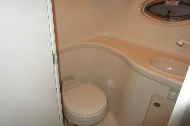 Slide: The Image of 2005 Sea Ray 290 Amberjack boat bathroom with toilet and sink. - 15