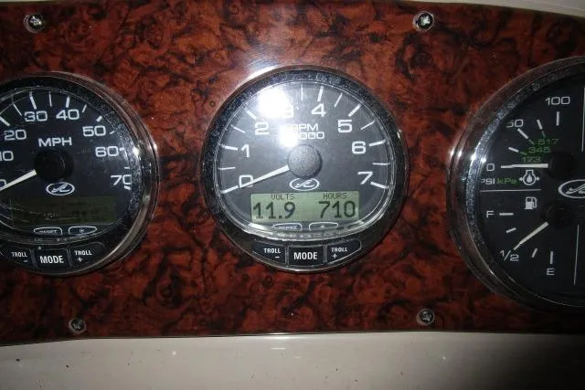 Slide: The Image of Dashboard of 2005 Sea Ray 290 Amberjack showing speed, RPM, and engine hours. - 19
