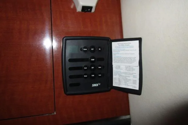 Slide: The Image of Control panel on 2005 Sea Ray 290 Amberjack boat with instruction manual. - 22