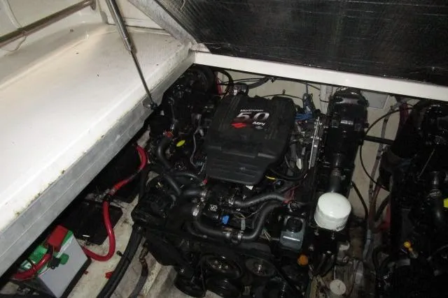 Slide: The Image of Engine compartment of a 2005 Sea Ray 290 Amberjack boat, featuring a MerCruiser 5.0 MPI engine. - 23