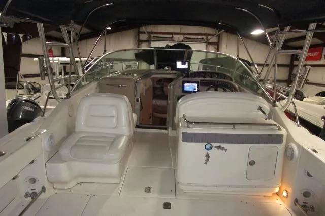 Slide: The Image of 2005 Sea Ray 290 Amberjack boat interior with seating and navigation equipment. - 4