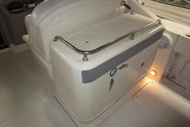 Slide: The Image of 2005 Sea Ray 290 Amberjack boat interior with seating and storage area. - 5