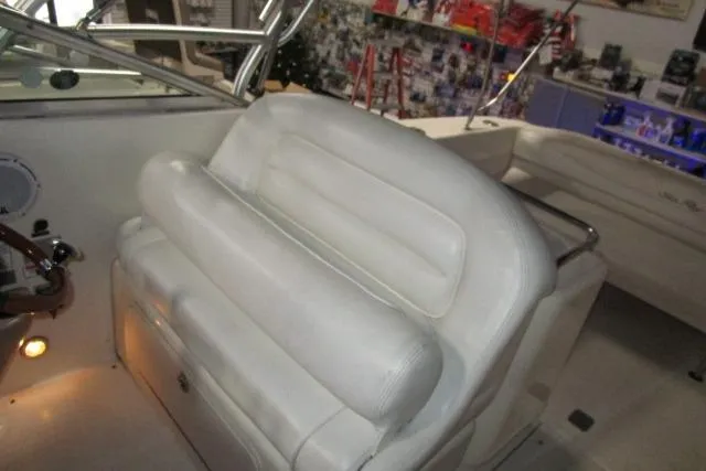 Slide: The Image of 2005 Sea Ray 290 Amberjack boat interior with white leather seating. - 9