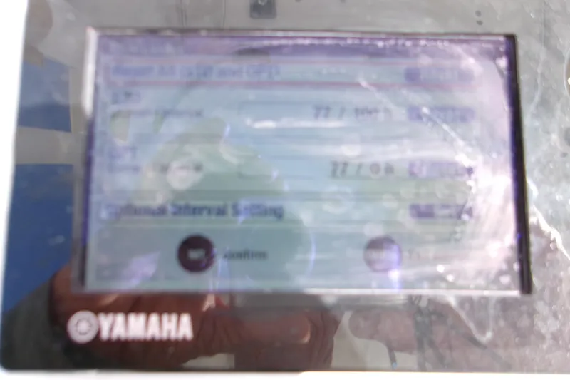 Slide: The Image of Yamaha display on 2014 Sportsman Heritage 241 Center Console boat, showing engine data. - 12