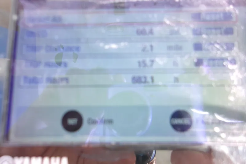 Slide: The Image of Blurry display screen showing engine data on a 2014 Sportsman Heritage 241 Center Console. - 18