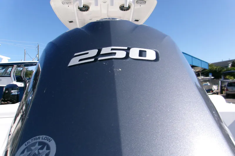 Slide: The Image of 2014 Sportsman Heritage 241 Center Console boat engine with "250" horsepower label. - 3
