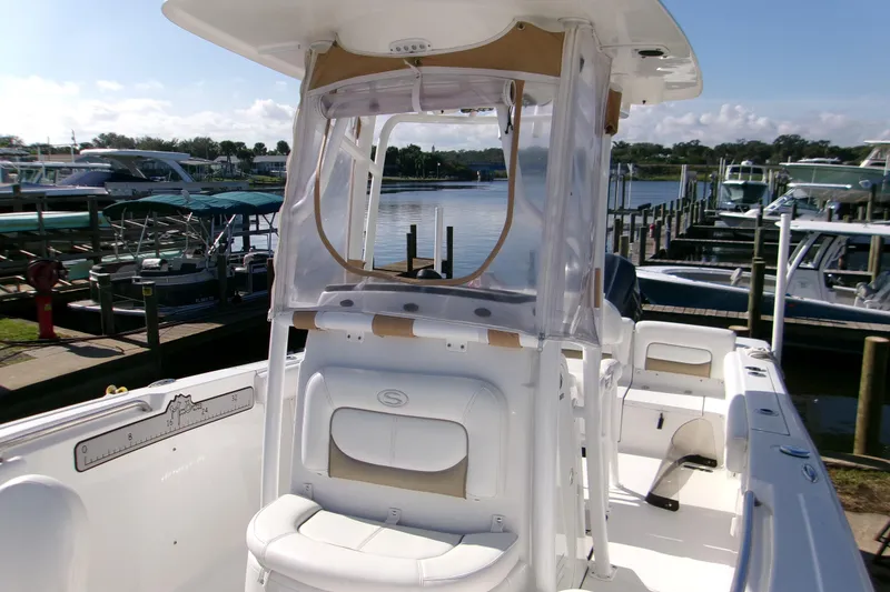 Slide: The Image of 2014 Sportsman Heritage 241 Center Console boat docked at marina. - 4