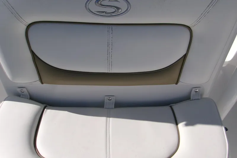Slide: The Image of White leather seat on 2014 Sportsman Heritage 241 Center Console boat. - 7