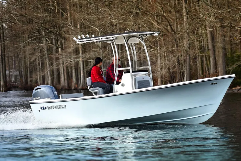 The Image of Manufacturer Provided Image: 2025 Defiance CATALINA 190 boat cruising on a serene lake with two passengers. - 1