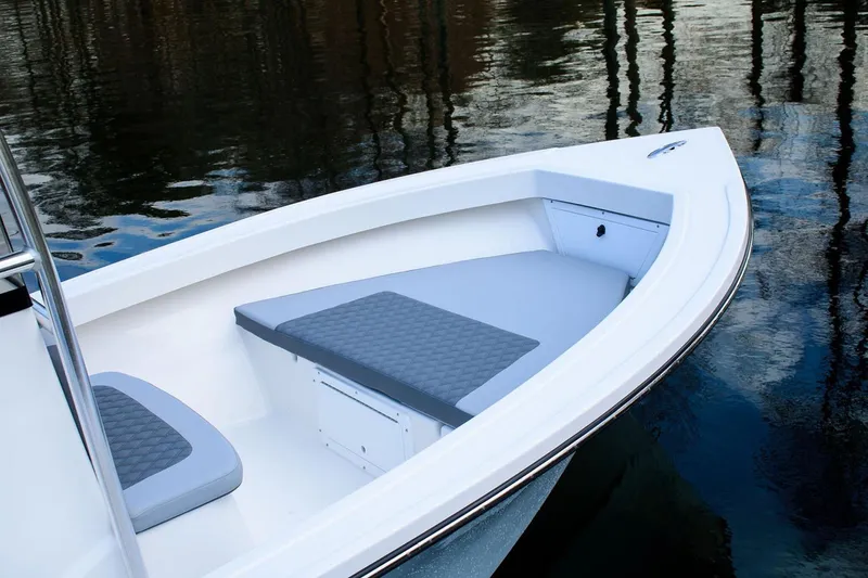 Slide: The Image of Manufacturer Provided Image: 2025 Defiance CATALINA 190 boat with cushioned seating on calm water. - 11
