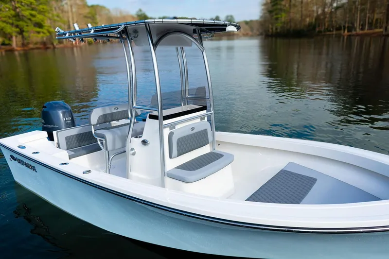 Slide: The Image of Manufacturer Provided Image: 2025 Defiance CATALINA 190 boat on a serene lake, featuring sleek design and modern seating. - 4