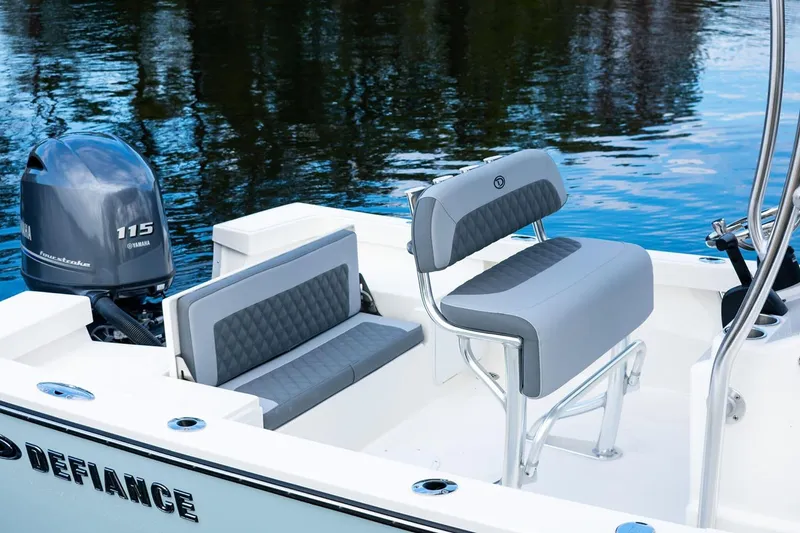 Slide: The Image of Manufacturer Provided Image: 2025 Defiance CATALINA 190 boat interior with Yamaha 115 engine, featuring sleek seating design. - 6