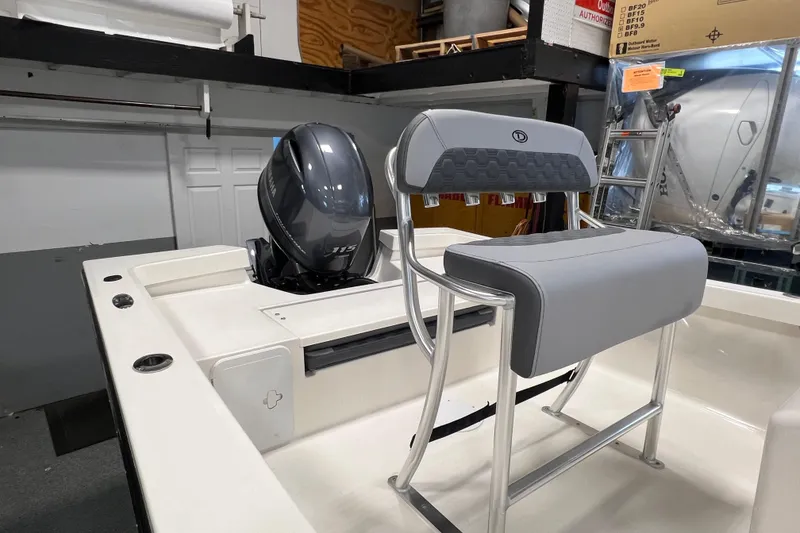Slide: The Image of 2026 Defiance Catalina 190 boat interior with Yamaha 115 engine and cushioned seating. - 7