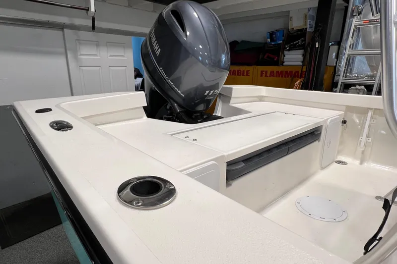 Slide: The Image of 2026 Defiance Catalina 190 boat with Yamaha 115 engine in a garage setting. - 8