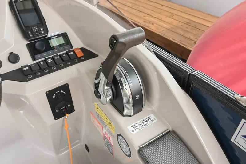 Slide: The Image of Control panel of 2022 Crest Classic DLX 220 boat with throttle and switches. - 24