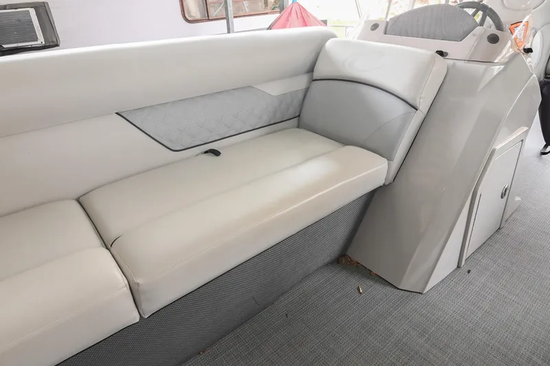 Slide: The Image of 2022 Crest Classic DLX 220 boat interior with plush seating and modern design. - 33