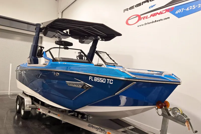 The Image of 2022 Nautique Super Air Nautique G25 Paragon boat in showroom on trailer. - 0