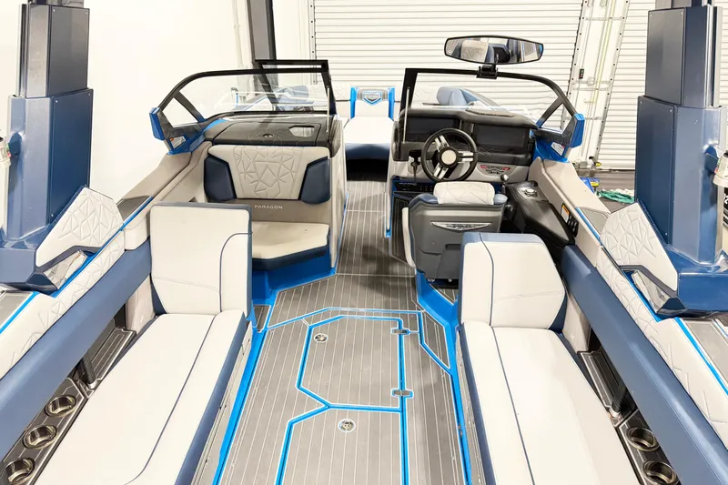 Slide: The Image of 2022 Nautique Super Air Nautique G25 Paragon interior with luxurious seating and modern design. - 13