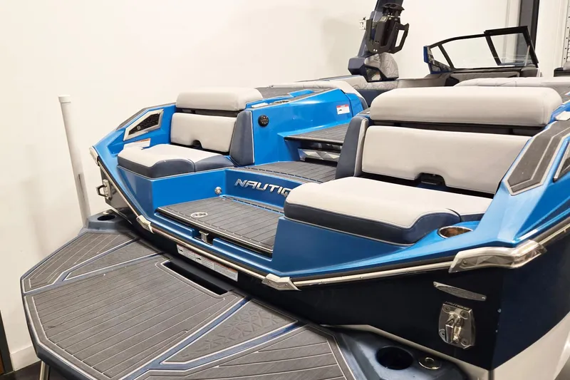 Slide: The Image of 2022 Nautique Super Air Nautique G25 Paragon, blue interior, luxury seating, modern design. - 4