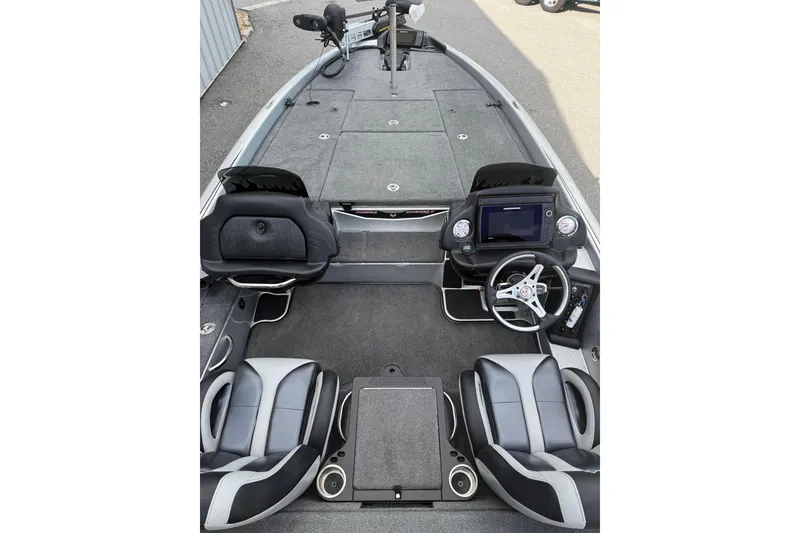 Slide: The Image of 2018 Phoenix 721 ProXP boat interior with dual seats, steering console, and spacious deck. - 10
