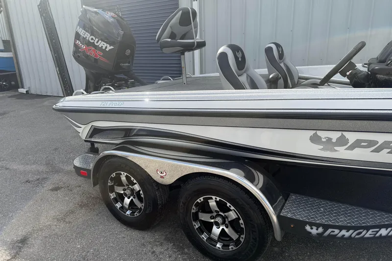 Slide: The Image of 2018 Phoenix 721 ProXP boat with Mercury Pro XS engine, parked on a trailer. - 3