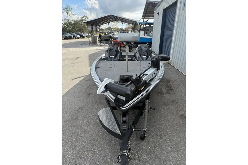 Slide: The Image of 2018 Phoenix 721 ProXP boat on trailer, parked outdoors near a building. - 5