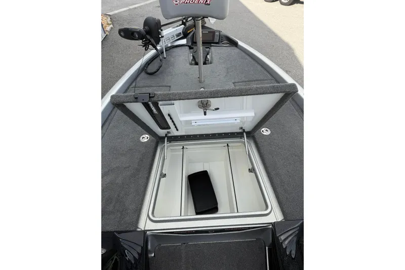 Slide: The Image of 2018 Phoenix 721 ProXP boat with open storage compartment and fishing equipment. - 8