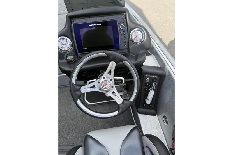 Slide: The Image of 2018 Phoenix 721 ProXP boat dashboard with steering wheel and Humminbird display. - 9
