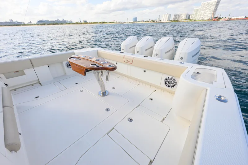 Slide: The Image of 2022 SeaVee 450Z boat deck with quad Mercury engines, spacious layout, and ocean view. - 10