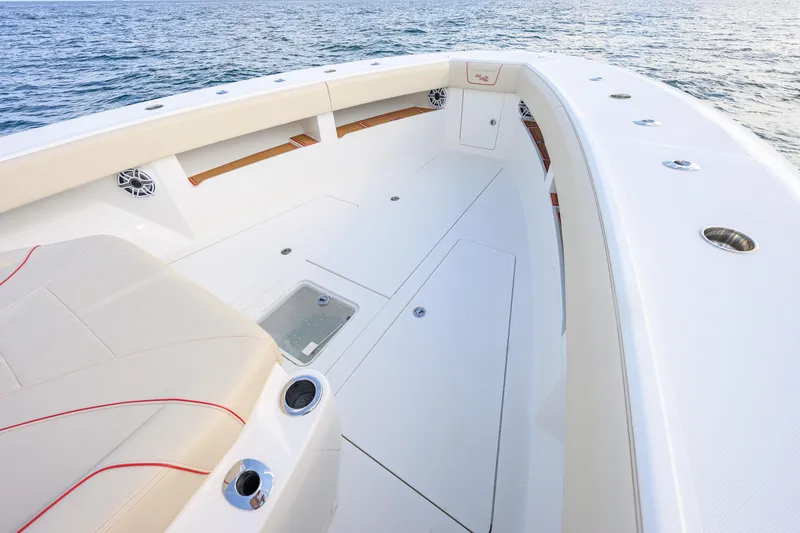 Slide: The Image of 2022 SeaVee 450Z boat interior with sleek seating and ocean backdrop. - 5